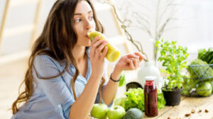 woman drinking a smoothie for a healthy diet to maintain optimal cortisol levels